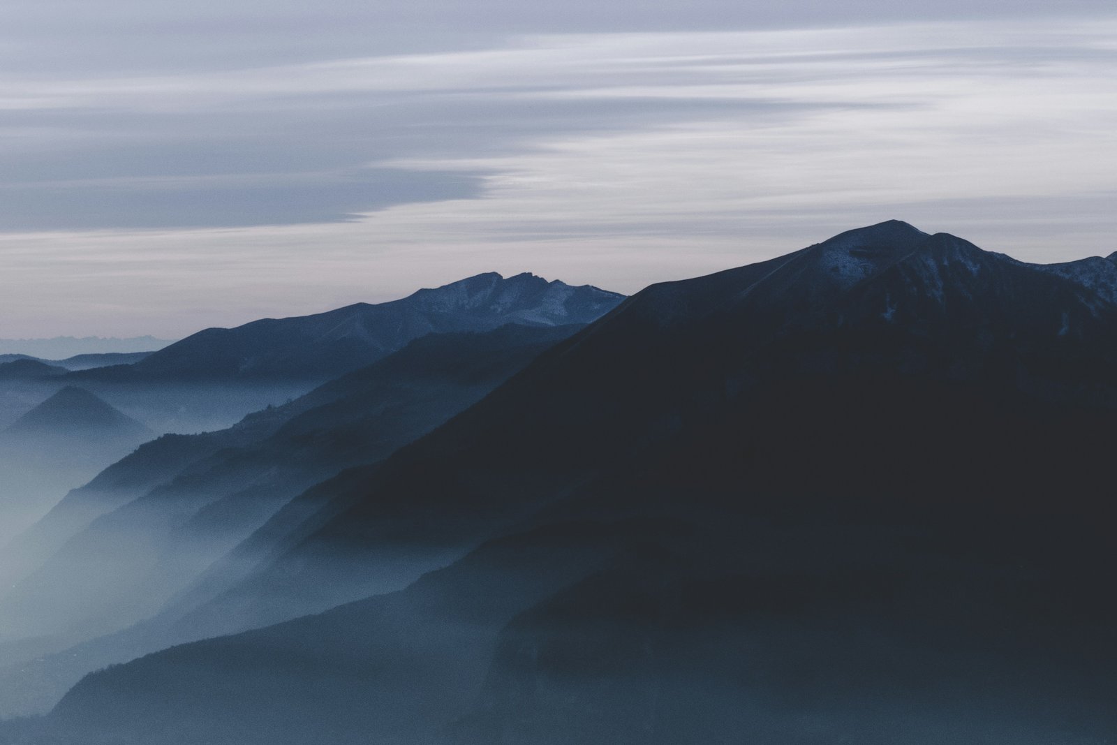 Silhouette of mountain ranges at dusk